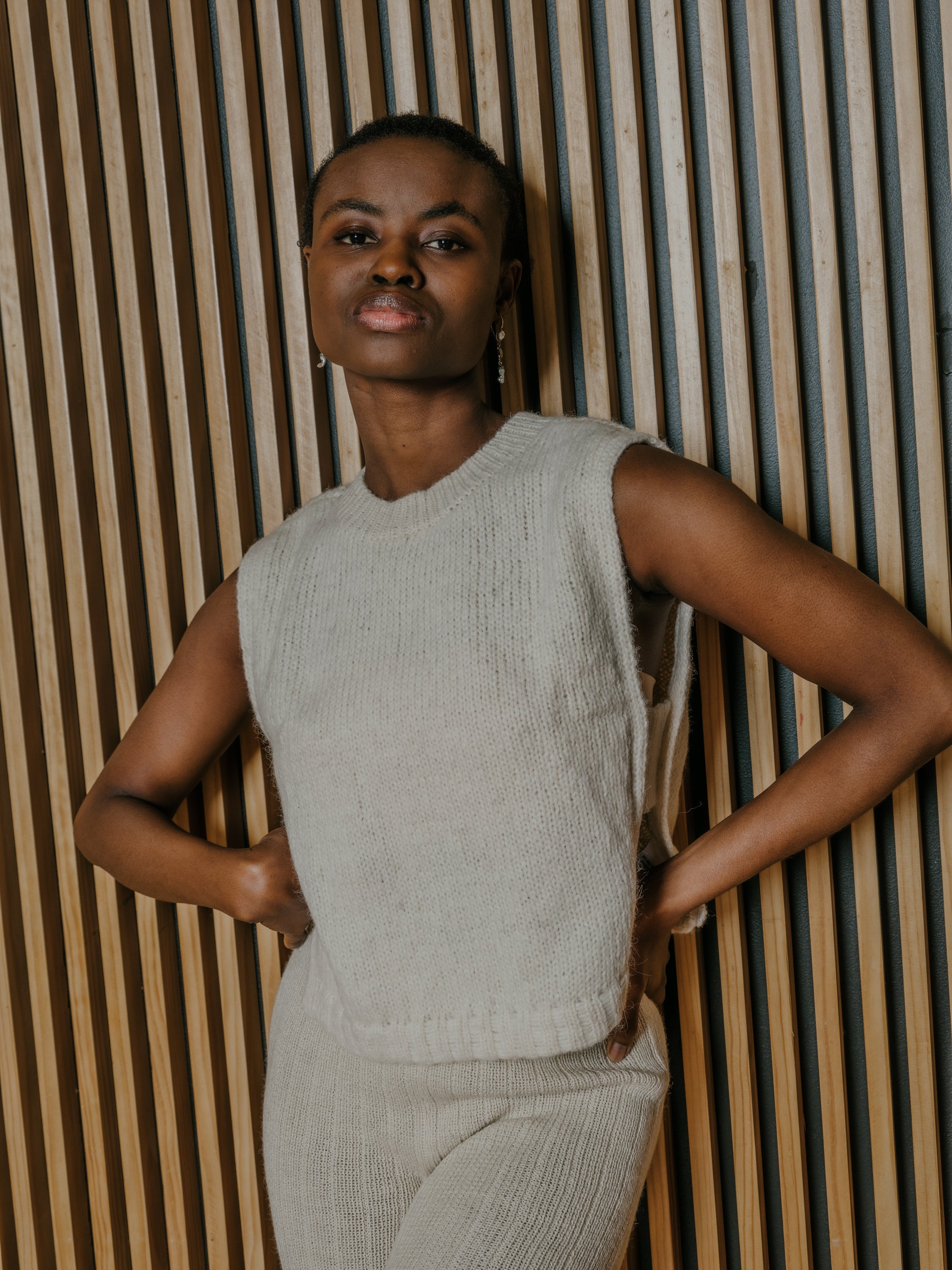 Munasiri Llama Vest — hand-knitted llama wool vest, timeless layering piece inspired by the Aymara word for love, handmade in Bolivia.