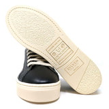 Sylven Mel Black/Oat vegan apple leather sneakers - with one shoe showing bottom soles